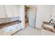 Well-appointed laundry room with granite countertops at 2033 Treasure Ln, Punta Gorda, FL 33982