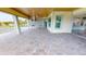 Outdoor patio with built-in kitchen and paver surface at 28944 Gin Ln, Punta Gorda, FL 33982