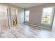 Bedroom with wood-look floors, and en-suite bathroom access at 28944 Gin Ln, Punta Gorda, FL 33982