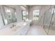 Elegant bathroom with double vanity, marble shower, and flooring at 28944 Gin Ln, Punta Gorda, FL 33982