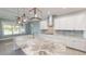 Modern kitchen with large island and view at 28944 Gin Ln, Punta Gorda, FL 33982