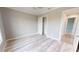 Spacious bedroom with wood-look floors and private closet at 28944 Gin Ln, Punta Gorda, FL 33982