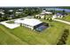Aerial view of single-Gathering home with private pool and lush landscaping at 28944 Gin Ln, Punta Gorda, FL 33982