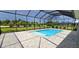 Relaxing screened-in pool with paver deck at 28944 Gin Ln, Punta Gorda, FL 33982