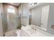 Modern bathroom with a glass shower and white vanity at 28944 Gin Ln, Punta Gorda, FL 33982
