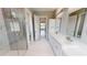 Spa-like bathroom with double sinks and herringbone tile shower at 28944 Gin Ln, Punta Gorda, FL 33982
