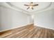 Spacious bedroom with wood-look floors and ceiling fan at 255 West End Dr # 1412, Punta Gorda, FL 33950