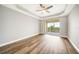 Large bedroom with ceiling fan and private balcony access at 255 West End Dr # 1412, Punta Gorda, FL 33950