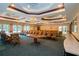 Large community room featuring ample seating and a beautiful chandelier at 255 West End Dr # 1412, Punta Gorda, FL 33950