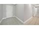 Tile hallway with access to rooms and closets at 255 West End Dr # 1412, Punta Gorda, FL 33950