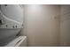 Stackable washer and dryer in a compact laundry room at 255 West End Dr # 1412, Punta Gorda, FL 33950