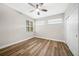 Bedroom with wood-look floors, ceiling fan, and window blinds at 255 West End Dr # 1412, Punta Gorda, FL 33950
