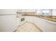 Well-equipped kitchen with white cabinets and granite countertops at 255 West End Dr # 1412, Punta Gorda, FL 33950