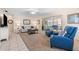 Bright living room with comfy seating and a sunroom at 6300 Midnight Pass Rd # 20, Sarasota, FL 34242