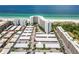 Aerial view of condo building and parking lot, highlighting a specific unit at 6300 Midnight Pass Rd # 20, Sarasota, FL 34242