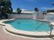 Inviting community pool with plenty of lounge chairs at 6300 Midnight Pass Rd # 20, Sarasota, FL 34242