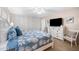 Spacious main bedroom with a king-size bed and built-in shelving at 6300 Midnight Pass Rd # 20, Sarasota, FL 34242