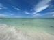 Scenic view of a tranquil beach with clear water at 6300 Midnight Pass Rd # 20, Sarasota, FL 34242