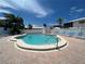 Relaxing kidney-shaped pool with lounge chairs at 6300 Midnight Pass Rd # 20, Sarasota, FL 34242