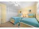 Guest bedroom with twin beds, ample closet space, and beachy decor at 6300 Midnight Pass Rd # 20, Sarasota, FL 34242