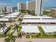Aerial view showcasing a beachfront unit's location within a complex at 6300 Midnight Pass Rd # 20, Sarasota, FL 34242