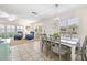 Open dining area with seating for six and view into living room at 6300 Midnight Pass Rd # 20, Sarasota, FL 34242