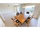 Bright dining room with water views and seating for six at 1 Colony Point Dr # 5C, Punta Gorda, FL 33950