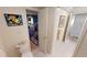 Bathroom with toilet and access to bedroom and hallway at 1 Colony Point Dr # 5C, Punta Gorda, FL 33950