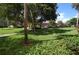 Landscaped grounds with covered parking and lush lawn at 1 Colony Point Dr # 5C, Punta Gorda, FL 33950