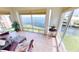 Sunroom with water view and comfortable seating at 1 Colony Point Dr # 5C, Punta Gorda, FL 33950
