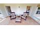 Relaxing sunroom with patio furniture and access to bedrooms at 1 Colony Point Dr # 5C, Punta Gorda, FL 33950