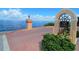 Private waterfront access with brick pavers and signage at 1 Colony Point Dr # 5C, Punta Gorda, FL 33950