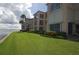 Condo building with waterfront lawn and landscaping at 1 Colony Point Dr # 5C, Punta Gorda, FL 33950