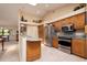 Well-equipped kitchen with wood cabinets, granite counters, and stainless steel appliances at 2505 Rio Tiber Dr, Punta Gorda, FL 33950