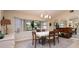 Formal dining area with wood table, chairs, and large window at 2505 Rio Tiber Dr, Punta Gorda, FL 33950