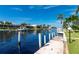 Scenic view of a peaceful canal with private dock and lush greenery at 2505 Rio Tiber Dr, Punta Gorda, FL 33950