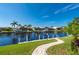 Peaceful waterfront view with dock and landscaping at 2505 Rio Tiber Dr, Punta Gorda, FL 33950