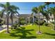 Inviting home with manicured lawn, lush landscaping, and a charming covered entrance at 2505 Rio Tiber Dr, Punta Gorda, FL 33950
