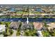 Aerial view of a single Gathering home situated on a canal with neighboring houses visible at 2505 Rio Tiber Dr, Punta Gorda, FL 33950