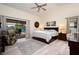 Main bedroom with king-size bed and access to lanai at 2505 Rio Tiber Dr, Punta Gorda, FL 33950