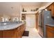 Kitchen featuring granite countertops, stainless steel refrigerator, and warm wood cabinets at 2505 Rio Tiber Dr, Punta Gorda, FL 33950