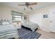 Guest bedroom with twin beds, ceiling fan, and nautical decor at 2505 Rio Tiber Dr, Punta Gorda, FL 33950