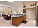 Open kitchen features granite countertops and island breakfast bar at 2505 Rio Tiber Dr, Punta Gorda, FL 33950