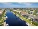 Wide canal view of waterfront homes and boats at 2505 Rio Tiber Dr, Punta Gorda, FL 33950