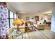Spacious living room with large windows and comfy seating at 234 Fields Se Ter, Port Charlotte, FL 33952