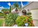 Attractive Florida home with lush landscaping and circular driveway at 234 Fields Se Ter, Port Charlotte, FL 33952