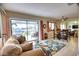 Casual dining area with table and chairs, leading to a relaxing screened porch at 234 Fields Se Ter, Port Charlotte, FL 33952
