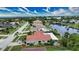 Single story home with tile roof, located on a quiet street next to the canal at 234 Fields Se Ter, Port Charlotte, FL 33952