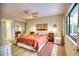 Main bedroom with king-size bed and water view at 234 Fields Se Ter, Port Charlotte, FL 33952
