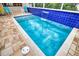 Relaxing pool with water feature and tiled surround at 234 Fields Se Ter, Port Charlotte, FL 33952